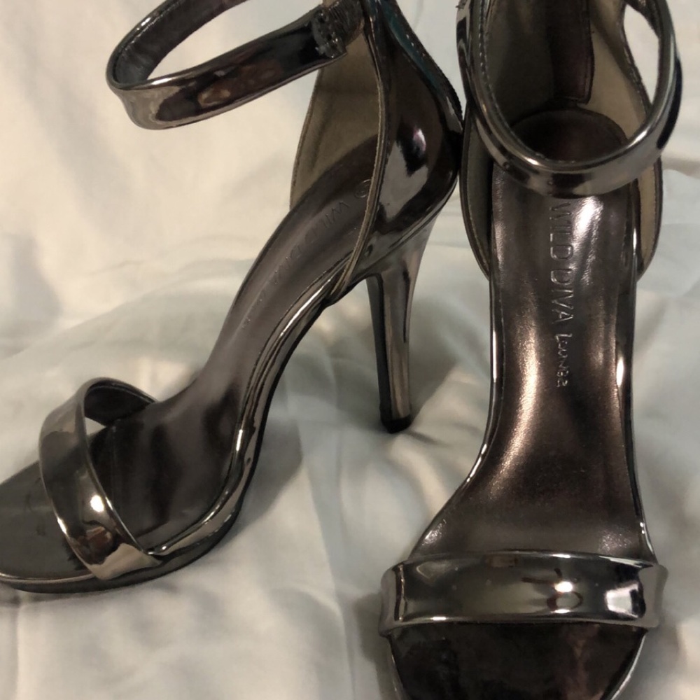 Open toe ankle strap high heel.
